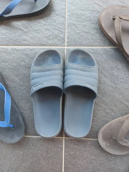 Blue Rubber Sandals Grey Floor Dirty Dusty — Stockfoto