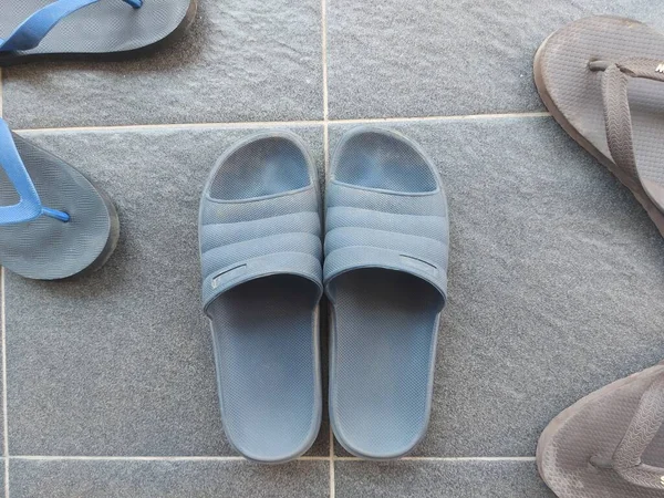 Blue Rubber Sandals Grey Floor Dirty Dusty — Stockfoto