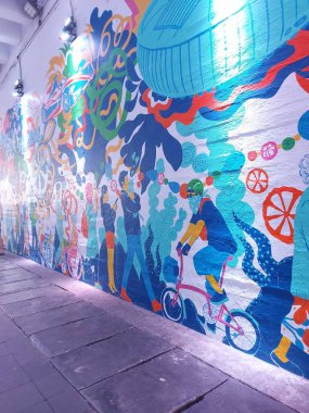 jakarta,indonesia-july 17 2022: mural on the wall under the tunnel in the SCBD area.  a place that is viral and famous becomes a place for fashion week