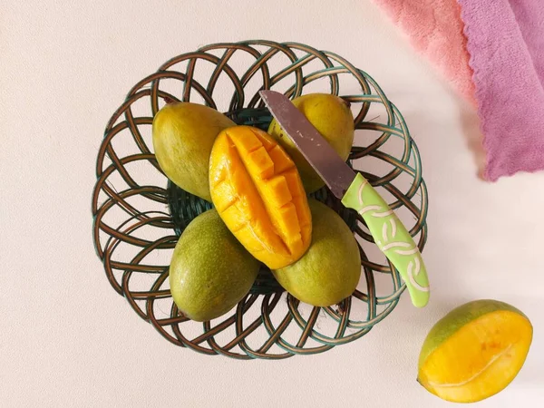Mangoes honey on a basket. it is one of the mango cultivars from Indonesia.  This mango is called Mango Honey because it tastes very sweet like Honey. top view