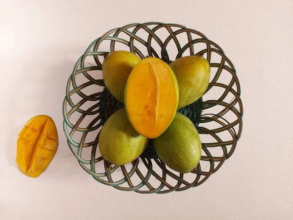 Mangoes honey on a basket. it is one of the mango cultivars from Indonesia.  This mango is called Mango Honey because it tastes very sweet like Honey. top view