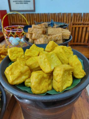 fried tofu on banana leaf. Served on clay plate