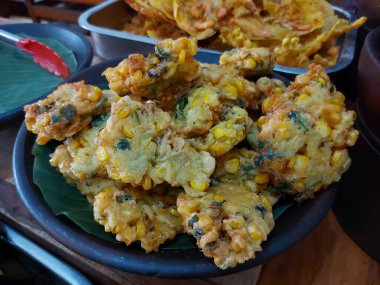 Corn fritters or perkedel jagung. It is traditional dish from indonesia. Made from flour, sweet corn and seasoning. Savory taste.