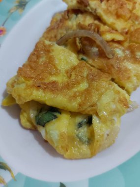 omelet served on white plate. Savory taste