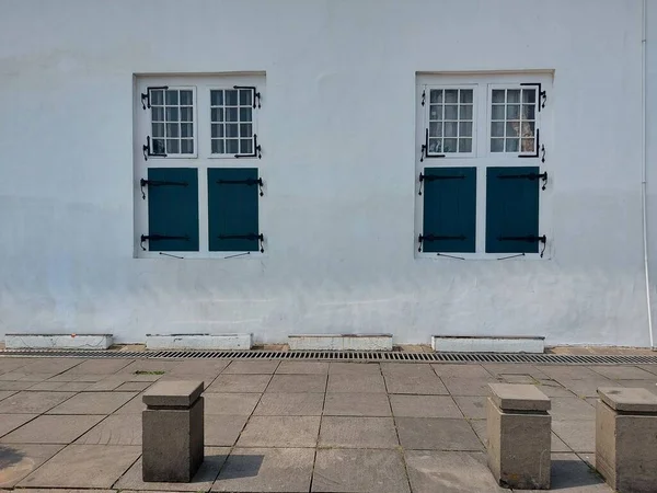 Dutch colonial style wooden windows. Vintage style. Minimalist and aesthetic photography. It can be used as background. Much space for text or quote