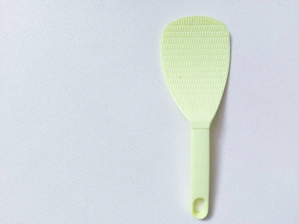 Green Rice Scoop Paddle Spatula Isolated Background White Copyspace Minimalist — Stock Photo, Image