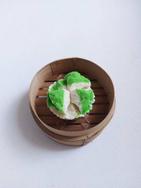 Bolu kukus. It is traditional steamed cake from Indonesia. Made from flour, eggs, sugar and soda water. Sweet taste