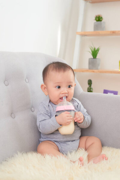Image of a baby drinking milk