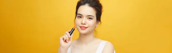Beautiful Asian Woman Holding Red Lip Gloss Yellow Background — Stock Photo, Image