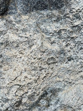 Sahilde büyük taşlar, arka plan