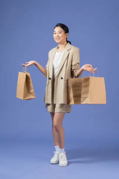 Happy Young Woman Shopping Bags Purple Background — Φωτογραφία Αρχείου