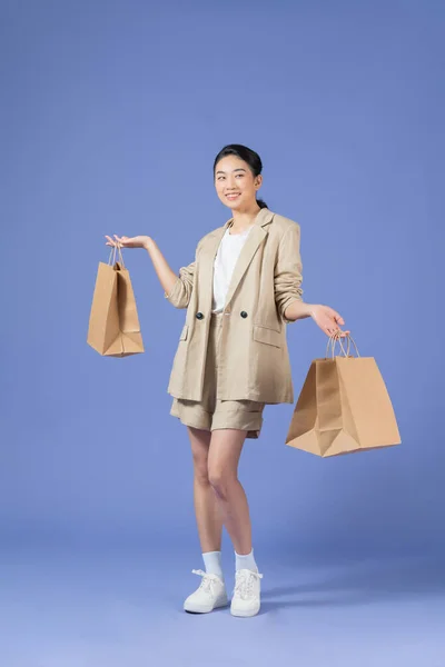 Photo Charming Funny Young Lady Smiling Holding Bargains Walking Jumping — 스톡 사진