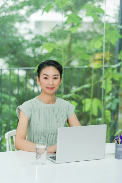 bright picture of happy woman with laptop computer