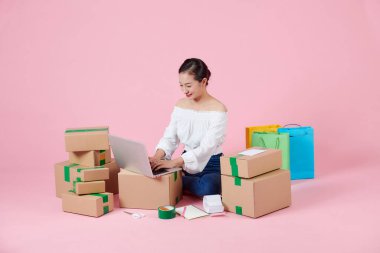 Young asian woman is entrepreneur work from home with online on notebook