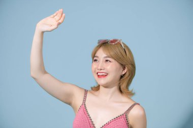 Close up photo of pretty optimistic lady raising hands up having free freedom inspiration isolated blue background