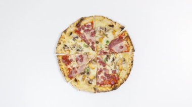 4k On a white background, slices of two types of pizza converge to the center forming a circle. Popular delicious food concept. Copy scace. Stop motion animation.