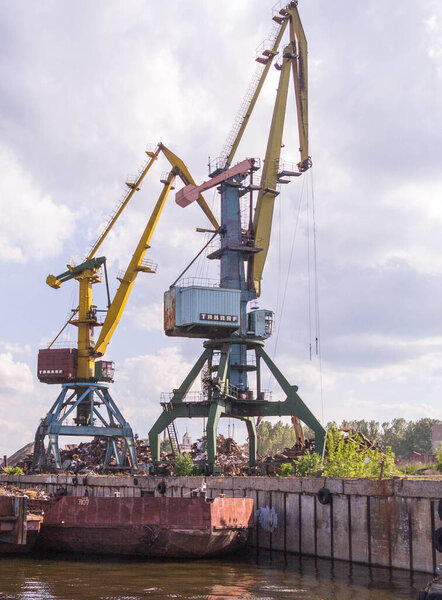 Container ship in export and import business and logistics. Shipping cargo to harbor by crane. Water transport International.