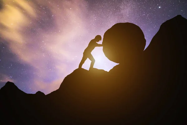 Sisyphus metaphor. Man rolling huge concrete ball up hill. Sisyphean work, task.Business man pushing large stone up to hill , Business heavy tasks and problems concept.