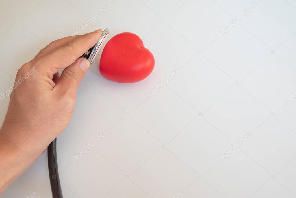 stethoscope in woman's hand.on white background.healthcare concept.world health workers day.