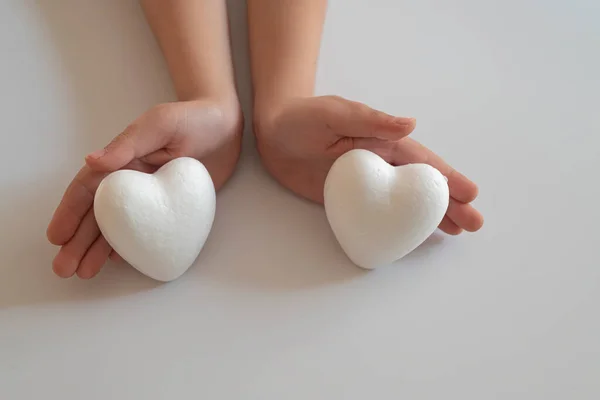 Heart in father son hands.Organ donation and insurance concept. World heart health concept. World organ donation day. Concept of healthy heart for healthy life. philanthropy idea concept.