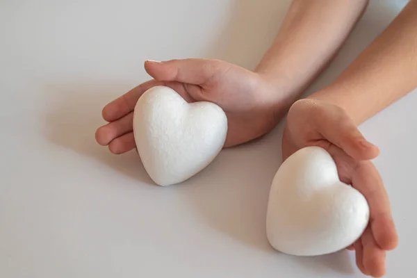 Heart in father son hands.Organ donation and insurance concept. World heart health concept. World organ donation day. Concept of healthy heart for healthy life. philanthropy idea concept.