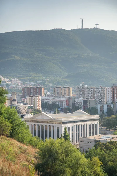 View from the Contemporary Art Museum of Macedonia. Perched on a hillside overlooking the city.From the hill at the Museum of modern art,looking towards the Vardar river, Archaeological Museum and Millenium Cross.