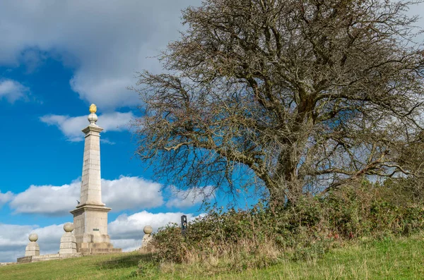 An Area Of Natural Beauty,a lone tree in front of the monument,erected 1904 to remember the 148 local men killed in the conflict in South Africa,overlooks Aylesbury Vale,forty miles west of London.
