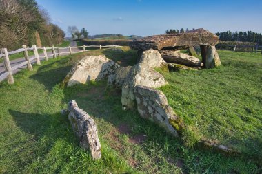 Large stones of the inner burial chamber,5000 years old.Close to Welsh border.Overlooking the Golden Valley, Herefordshire and the Wye Valley,linked to King Arthur.Sunny spring day,close to sunset. clipart