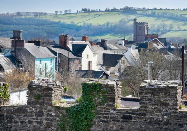 Near the Brecon Beacons and beautiful south Welsh countryside,the morning sun shining on it\'s distant hills and another church on the edge of town.