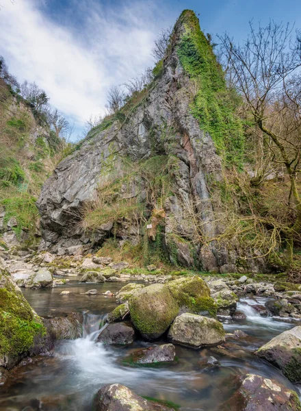 Wheelchair accessible,short 400m walk from car park,The Afon Sychryd river in Rhondda Cynon Taf,easiest to get to,near Dinas Rock,cascades of water,motion blur of water over rocks and old ruins.