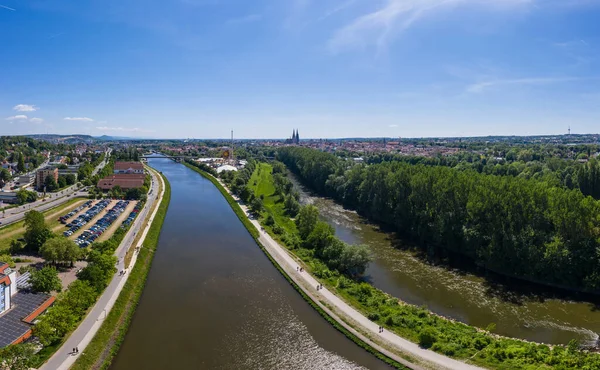 Drone panorama of the city of Regensburg in Bavaria with a view of the Dult folk festival and cathedral, Germany