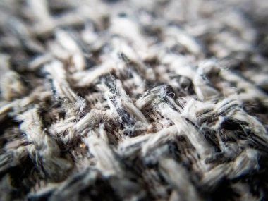 Makro kumaş üzerinde seçici odak dokusu kanepe arka plan görüntü dokusu siyah desenle karışmış gri desen