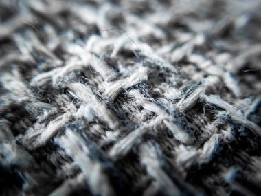 Makro kumaş üzerinde seçici odak dokusu kanepe arka plan görüntü dokusu siyah desenle karışmış gri desen