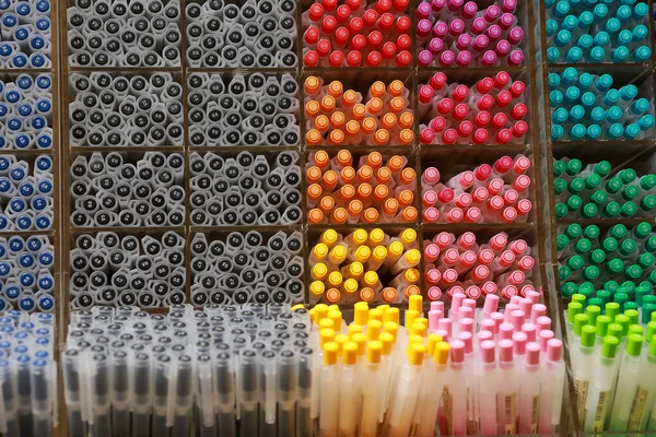 Colorful pens on display boxes in a stationery stor