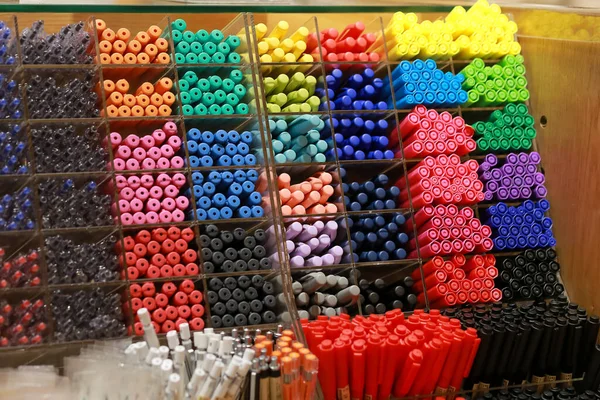 Colorful pens on display boxes in a stationery stor