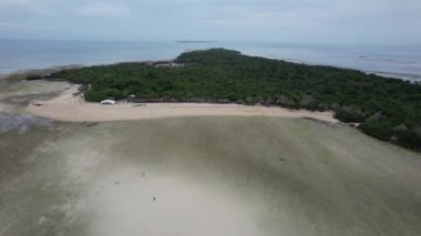 aerial view of a green island with sand and oeach, zanzibar