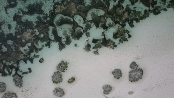 Drone footage of a ocean stones