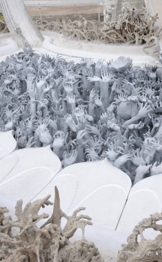 Hand sculptures at the Buddhist White Temple (Wat Rong Khun)  in Chiang Rai Thailand.  