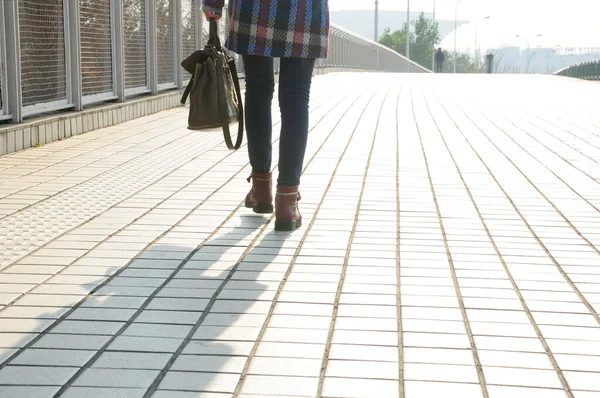 Woman Walking Tiled Sidewalk Holding Purse Her Shadow Her — Stock Photo, Image