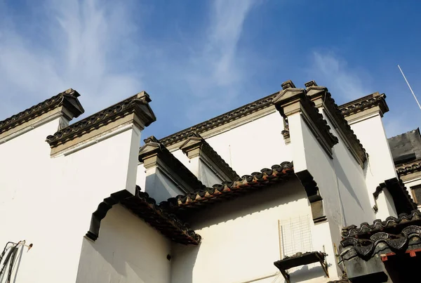 A white building incorporating Nanjing styled Asian architecture in the Nanjing China.  
