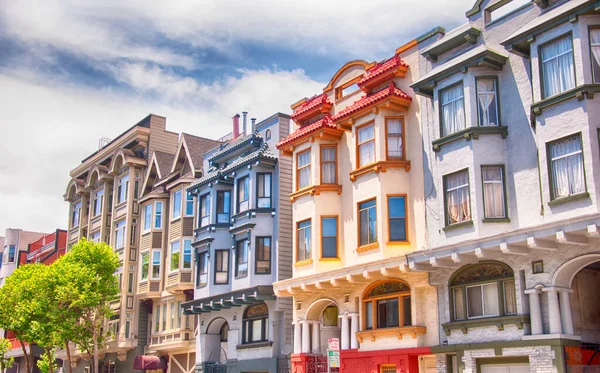 stock image Colorful buildings lining a street in the city of san franscisco california on a sunny blue sky day. 