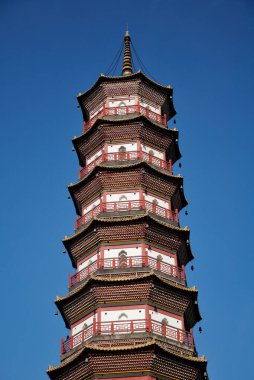 Chigang Pagoda or tower in the city of Guangzhou china in Guangdong province against a blue sky.  