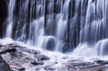 A blurred waterfall at burr pond state park in Torrington connecticut