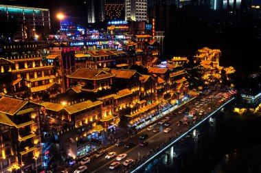 Chongqing, China.  June 23, 2018.  The Hongya caves scenic area lit up at night in Yuzhong district of Chongqing China.