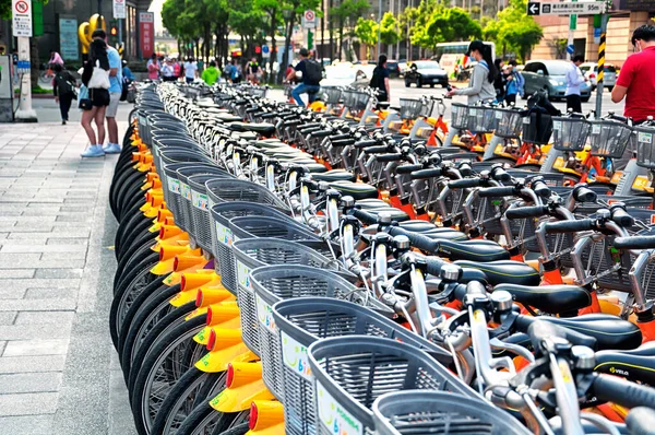 Many bicycles for rent lined up next to each other in the city of Taipei, Taiwan.