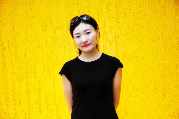 Chinese Woman Wearing Black Shirt Front Yellow Wall — 스톡 사진