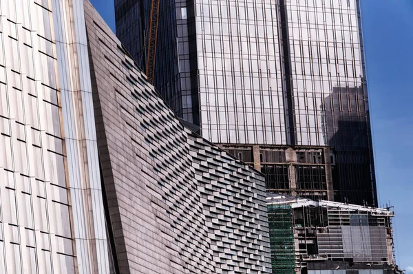 An abstract picture of the exterior of modern buildings in the futian district of shenzhen china on a sunny day.