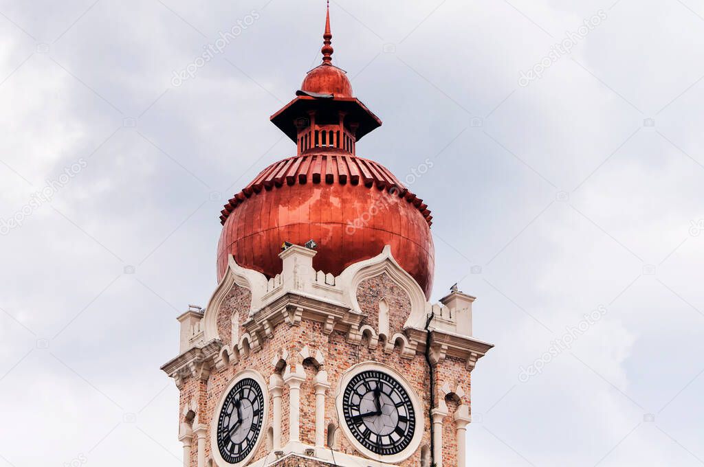 The copper domed clock tower on the Sultan Abdul Samad building in Merdeka Square, Kuala Lumpur Malaysia. 