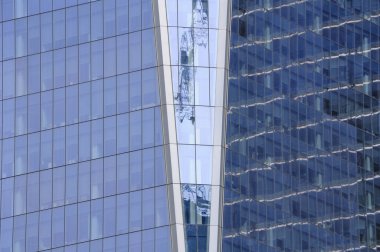 A zoomed in image of the glass windows of the exterior of the Freedom Tower in Manhattan in New York City. 