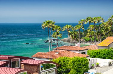 Malibu beach homes lining the pacific coast highway in sunny california.